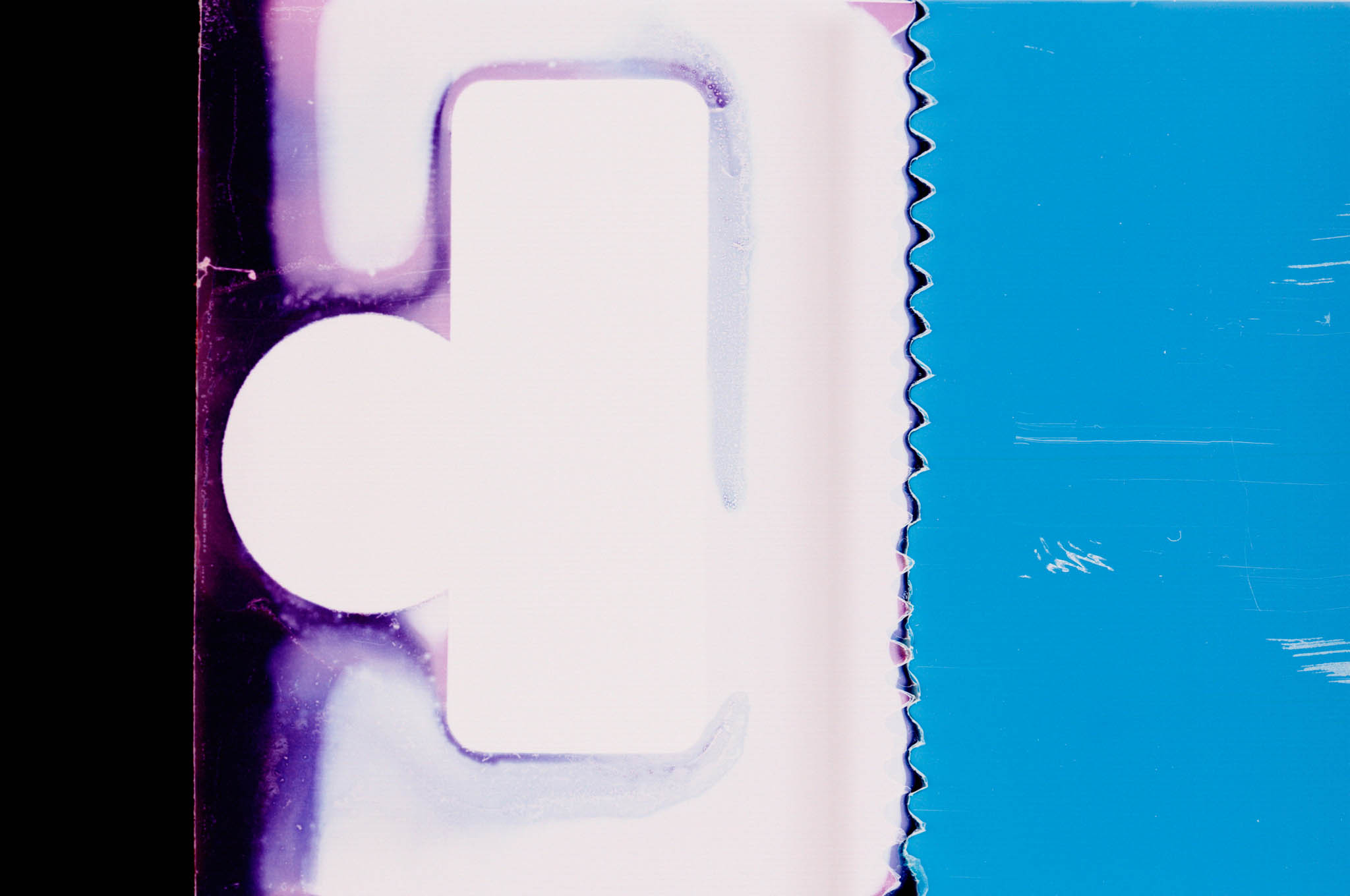 Close-up of abstract pattern with purple hues and a zigzag blue edge on the right side.