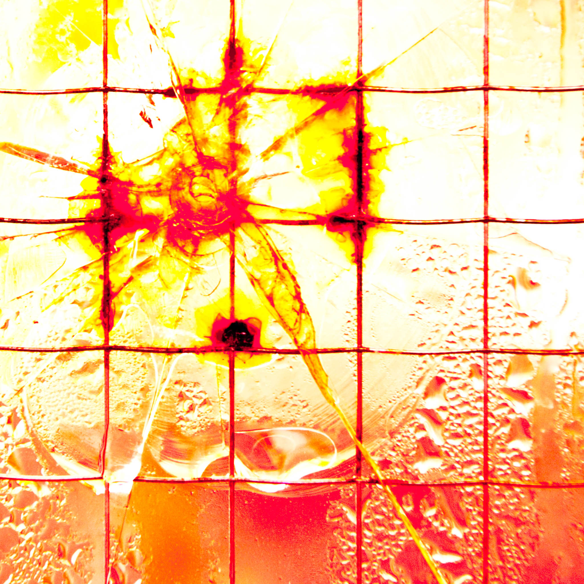 Cracked stained glass with fiery red and yellow patterns in a grid layout.